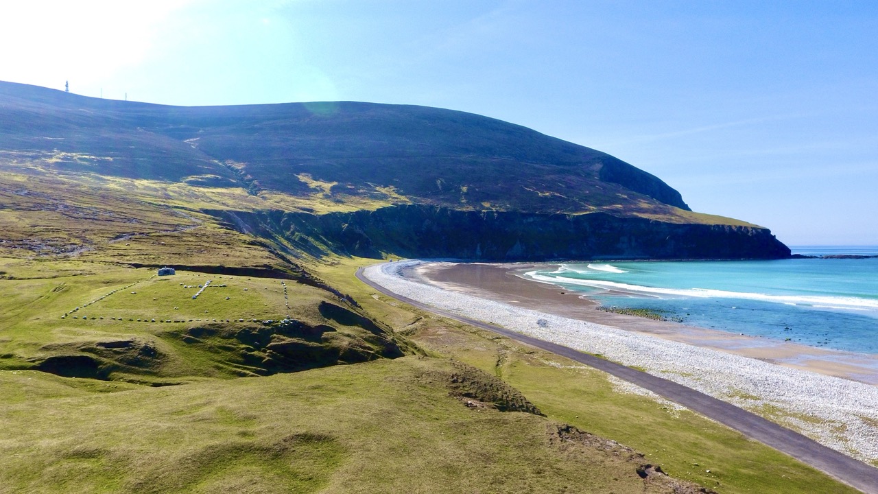 Aerial view of Achill coastline, beach and mountain slopes