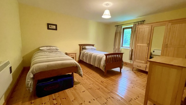 Twin bedroom with wardrobes and natural light