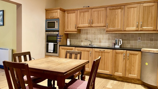 Wooden kitchen with dining table