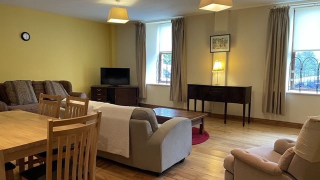 Living room with armchairs, sofa and soft window light