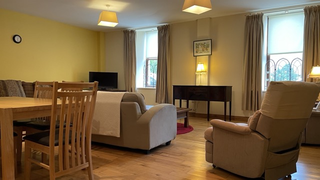 Open living room with dining table and lounge seating