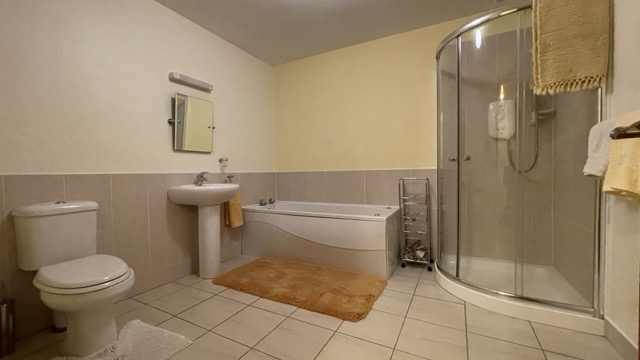 Bathroom with bath, sink and separate shower