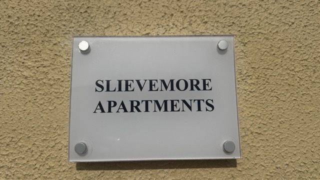 Slievemore Apartments sign mounted on the building exterior