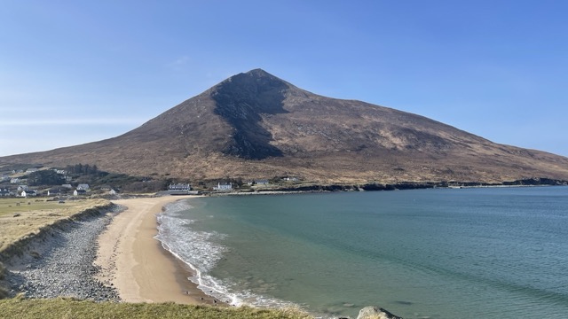 Slievemore Mountain rising above Dugort beach and turquoise water
